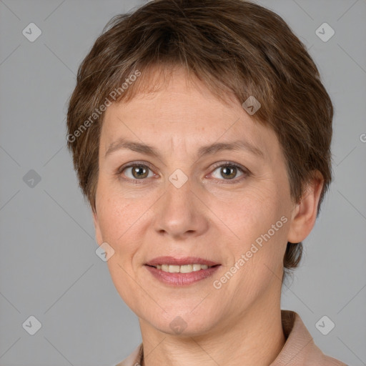 Joyful white adult female with short  brown hair and grey eyes