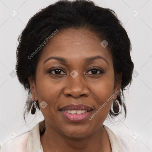 Joyful black adult female with medium  brown hair and brown eyes