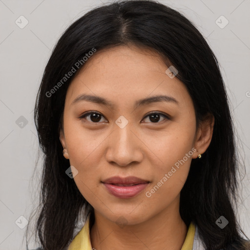 Joyful latino young-adult female with long  brown hair and brown eyes