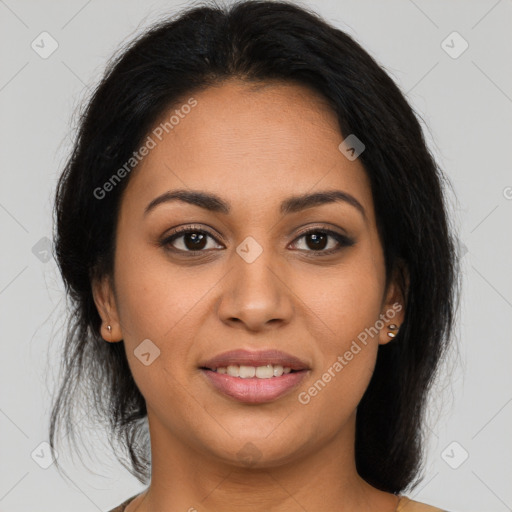 Joyful latino young-adult female with medium  brown hair and brown eyes