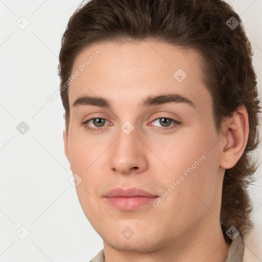 Joyful white young-adult male with medium  brown hair and brown eyes