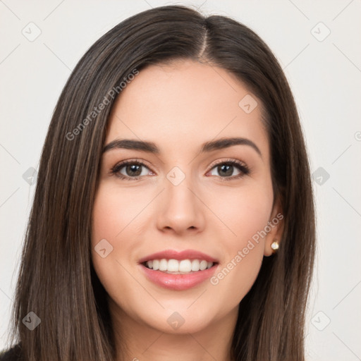 Joyful white young-adult female with long  brown hair and brown eyes