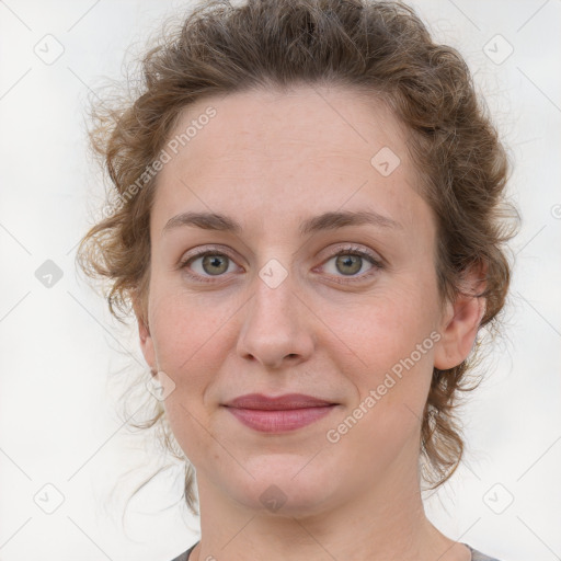 Joyful white young-adult female with medium  brown hair and blue eyes