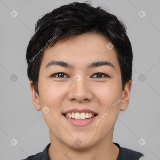 Joyful asian young-adult male with short  black hair and brown eyes