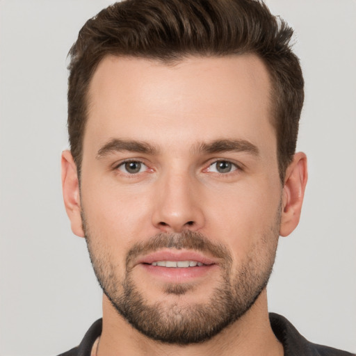 Joyful white young-adult male with short  brown hair and brown eyes