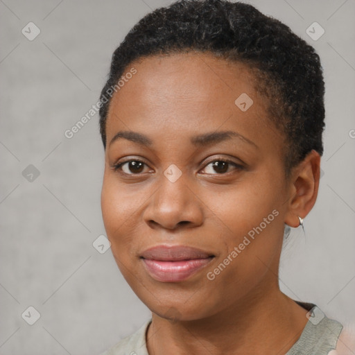 Joyful black young-adult female with short  black hair and brown eyes