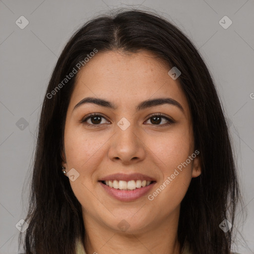 Joyful latino young-adult female with long  brown hair and brown eyes