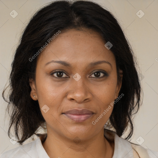 Joyful black adult female with medium  brown hair and brown eyes