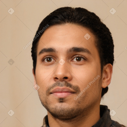 Neutral latino young-adult male with short  black hair and brown eyes