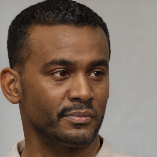 Neutral black young-adult male with short  brown hair and brown eyes