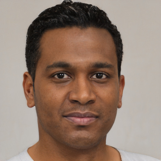 Neutral black young-adult male with short  black hair and brown eyes