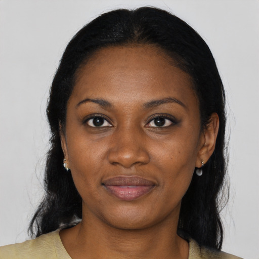 Joyful black young-adult female with medium  black hair and brown eyes