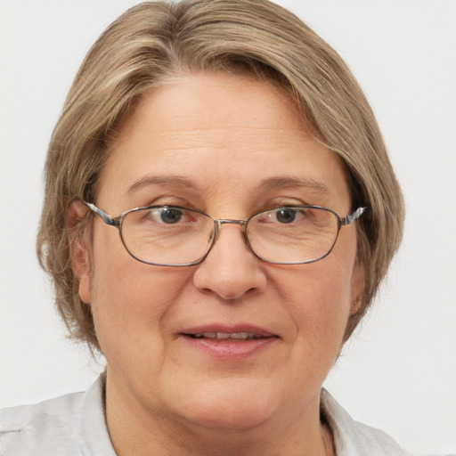 Joyful white adult female with medium  brown hair and blue eyes