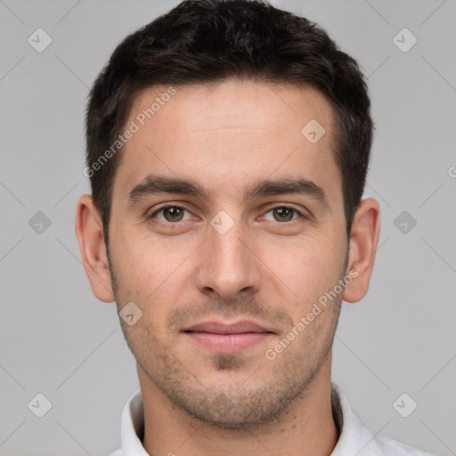 Joyful white young-adult male with short  brown hair and brown eyes