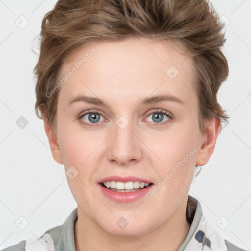 Joyful white young-adult female with short  brown hair and blue eyes