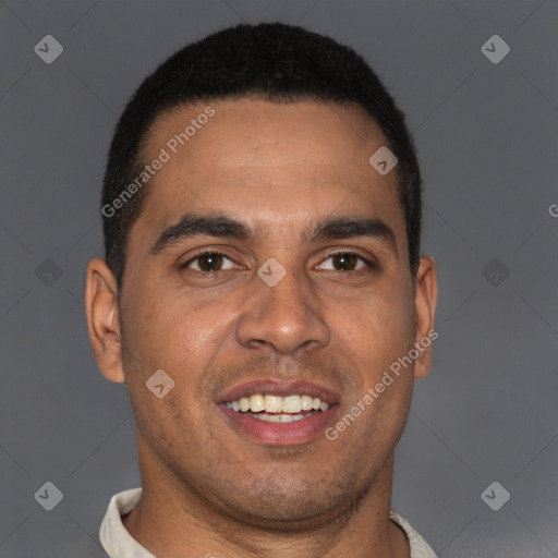 Joyful latino young-adult male with short  brown hair and brown eyes