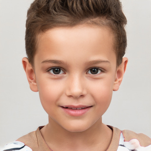 Joyful white child male with short  brown hair and brown eyes