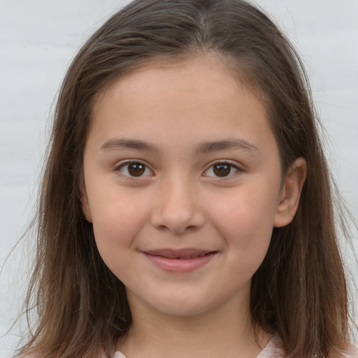 Joyful white child female with long  brown hair and brown eyes