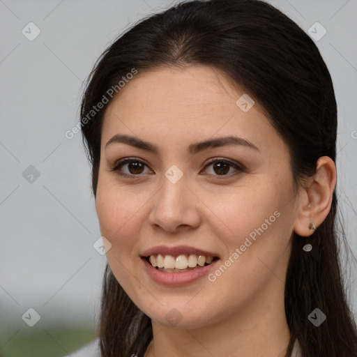 Joyful white young-adult female with long  brown hair and brown eyes