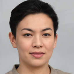 Joyful asian young-adult female with short  black hair and brown eyes