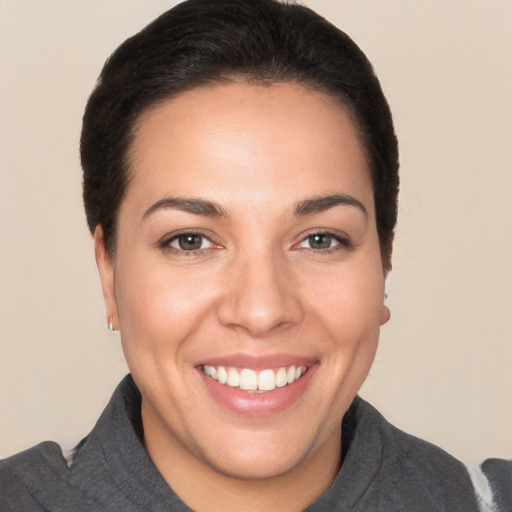 Joyful white young-adult female with short  brown hair and brown eyes