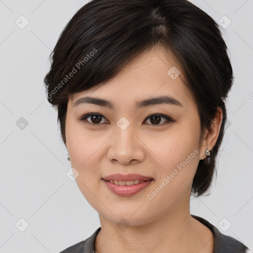 Joyful asian young-adult female with medium  black hair and brown eyes