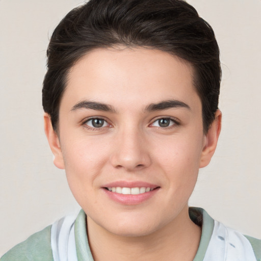 Joyful white young-adult female with medium  brown hair and brown eyes