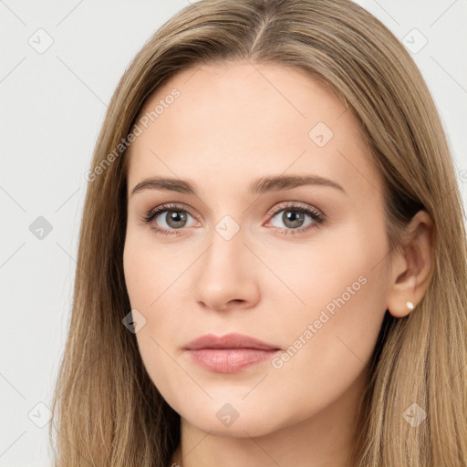 Neutral white young-adult female with long  brown hair and brown eyes