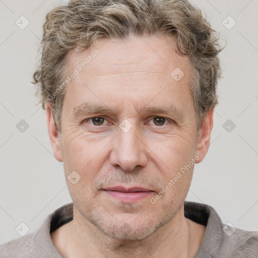 Joyful white adult male with short  brown hair and grey eyes