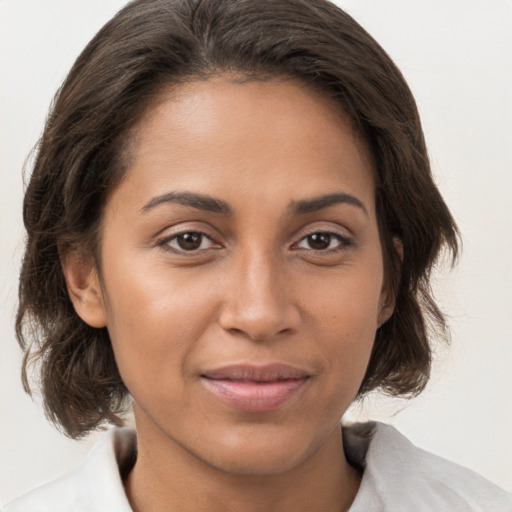 Joyful white young-adult female with medium  brown hair and brown eyes