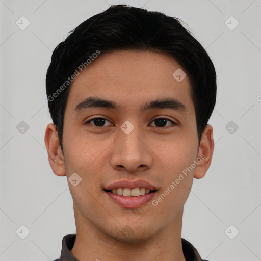 Joyful asian young-adult male with short  black hair and brown eyes