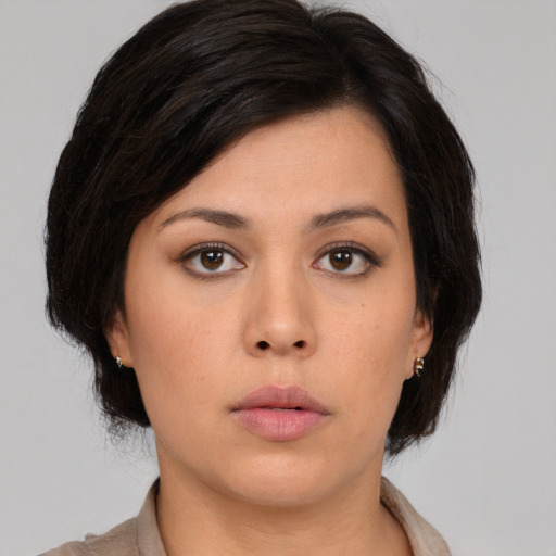 Neutral asian young-adult female with medium  brown hair and brown eyes