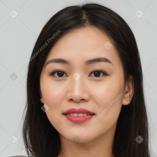 Joyful asian young-adult female with long  brown hair and brown eyes