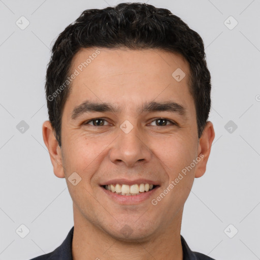 Joyful white young-adult male with short  black hair and brown eyes