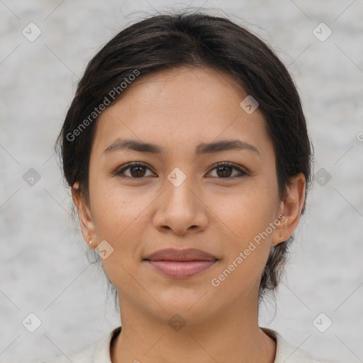 Joyful latino young-adult female with medium  brown hair and brown eyes