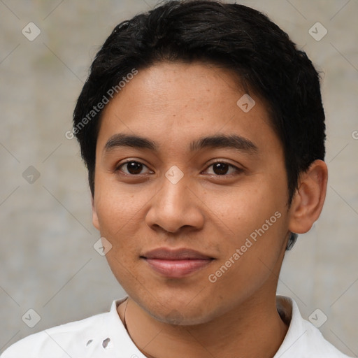 Joyful latino young-adult male with short  black hair and brown eyes