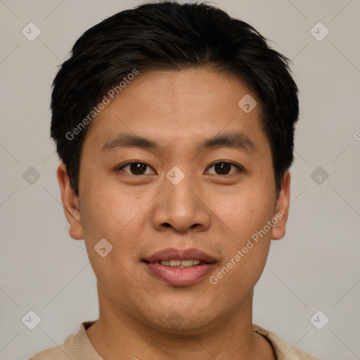 Joyful asian young-adult male with short  brown hair and brown eyes