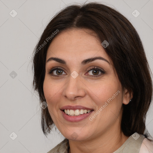 Joyful white adult female with medium  brown hair and brown eyes