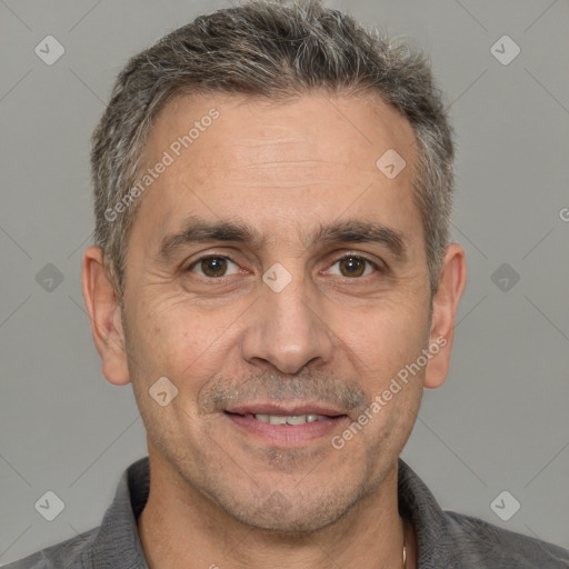 Joyful white adult male with short  brown hair and brown eyes