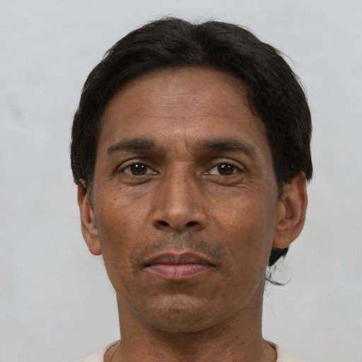 Neutral black adult male with short  black hair and brown eyes