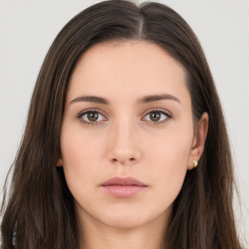 Neutral white young-adult female with long  brown hair and brown eyes