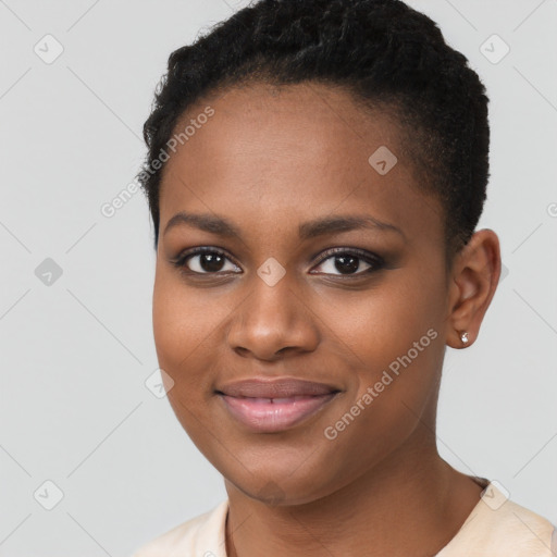 Joyful black young-adult female with short  brown hair and brown eyes