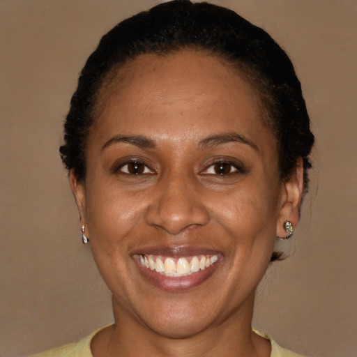 Joyful latino adult female with short  brown hair and brown eyes
