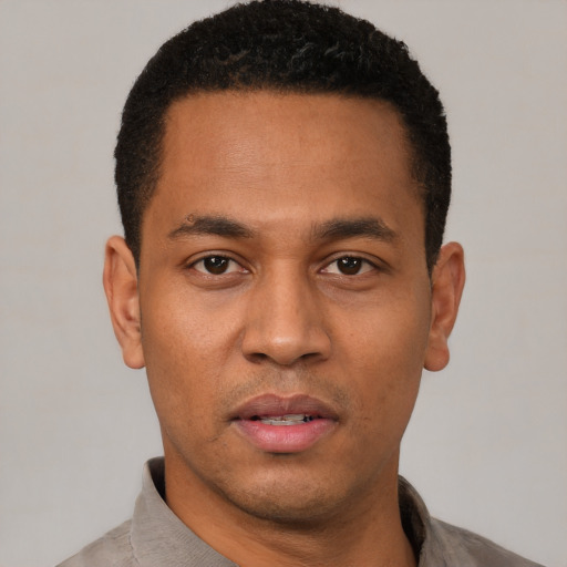 Neutral latino young-adult male with short  black hair and brown eyes
