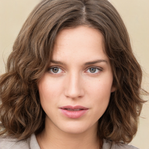 Neutral white young-adult female with medium  brown hair and green eyes