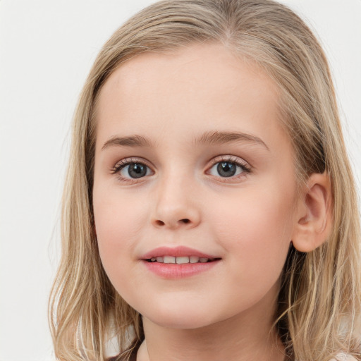 Joyful white child female with long  brown hair and grey eyes