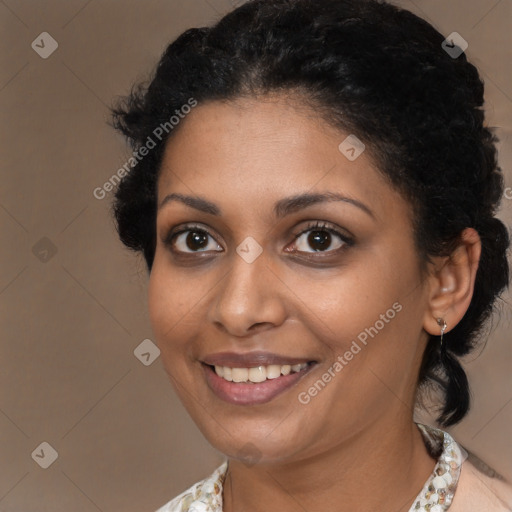 Joyful black young-adult female with medium  brown hair and brown eyes