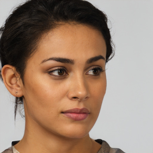 Neutral latino young-adult female with short  brown hair and brown eyes