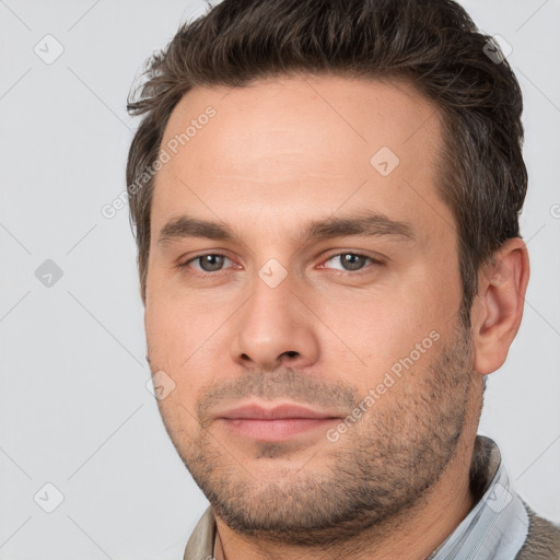 Neutral white young-adult male with short  brown hair and brown eyes