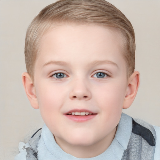 Joyful white child female with short  brown hair and blue eyes